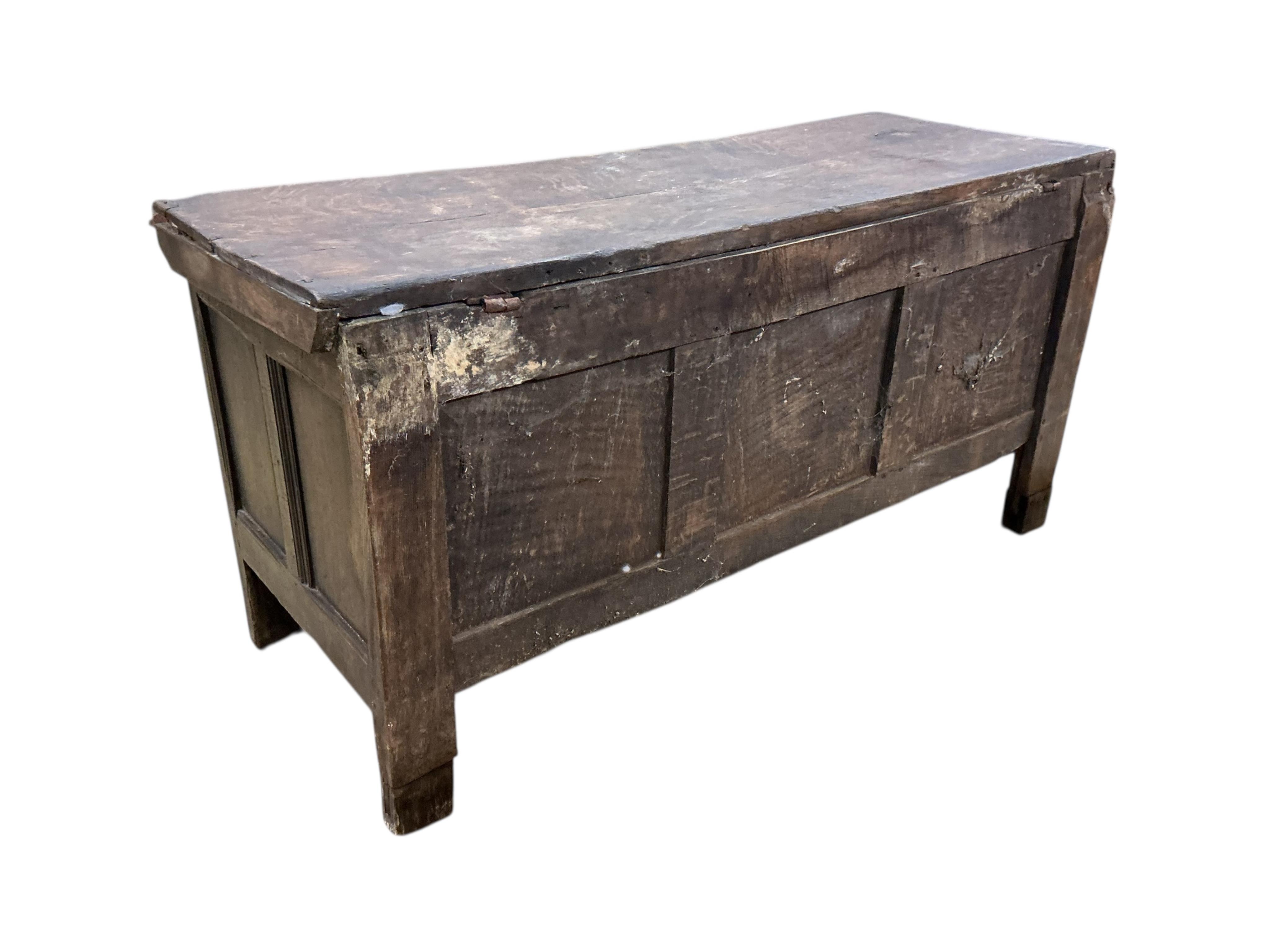 An 18th century panelled oak coffer, width 144cm, depth 54cm, height 72cm